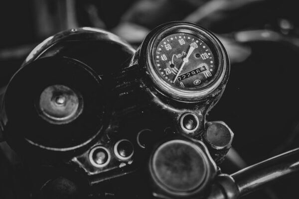 How Much Does a Motorcycle Cost — and the Three Laws That Count Wheels Before They Answer
